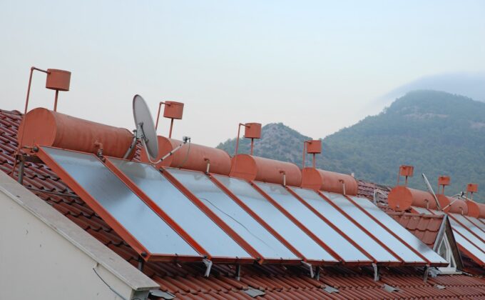 Solar panels and water storage on rooftops of houses in Turkey